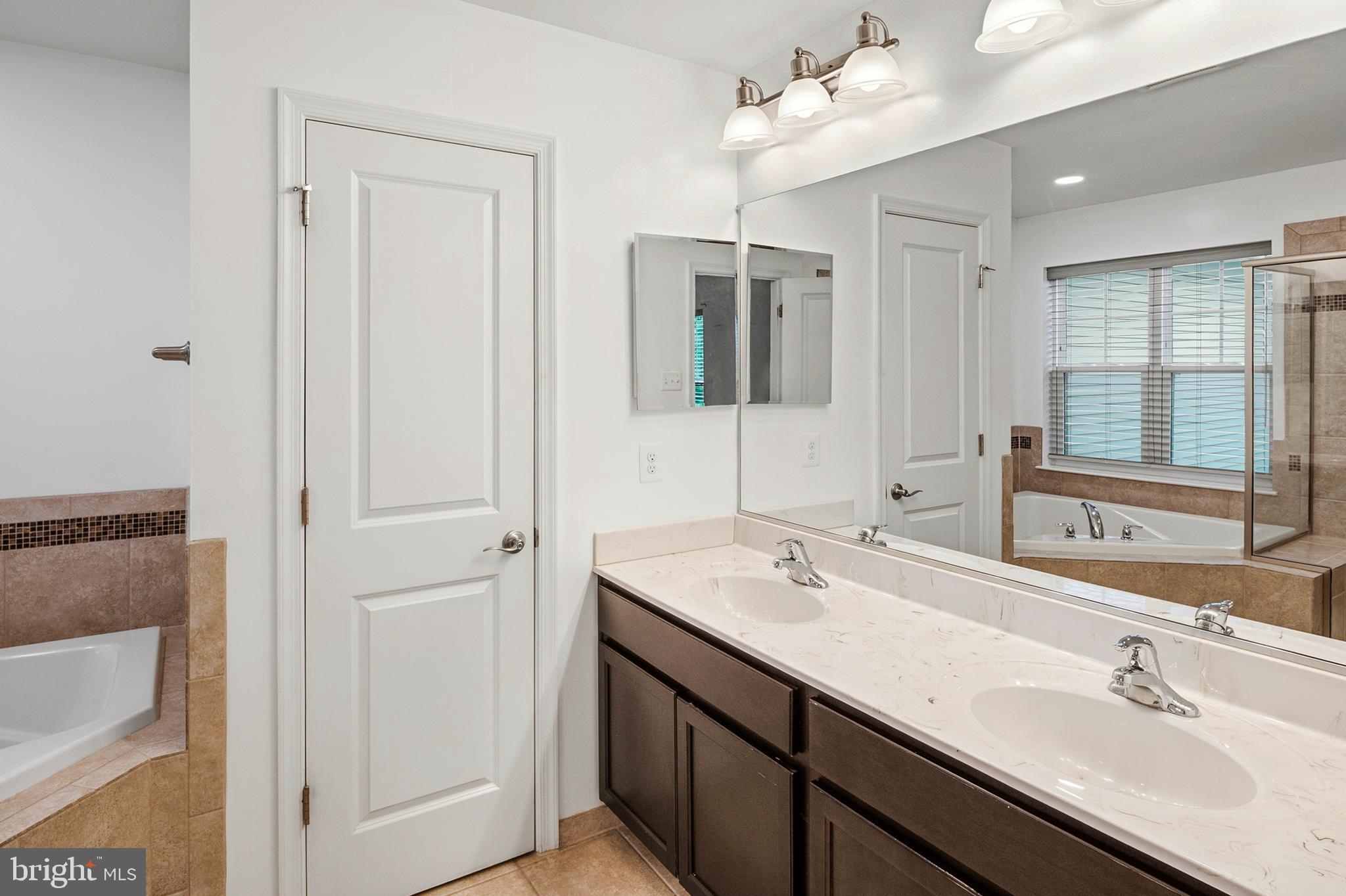 33 Greensborough Road Reisterstown, MD 21136 - Photo 31 of 40 a bathroom with a sink vanity and mirror