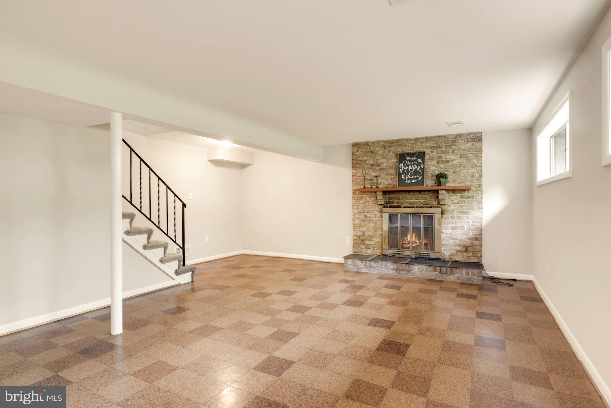 2019 Franwall Avenue Silver Spring, MD 20902 - Photo 23 of 42 Family room, with fireplace and mantle, windows
