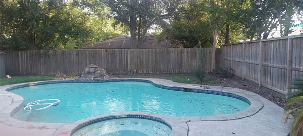 a view of a backyard with a small cabin and a small cabin