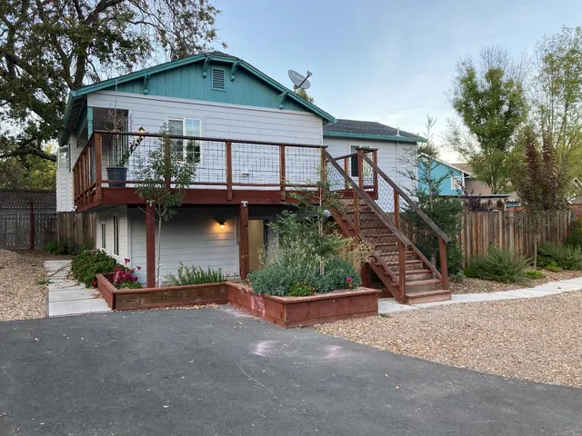 a front view of a house with garden