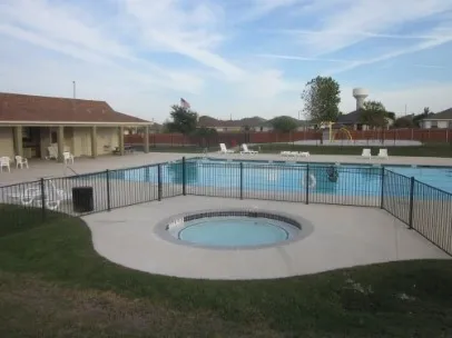 a view of a swimming pool with a lake view