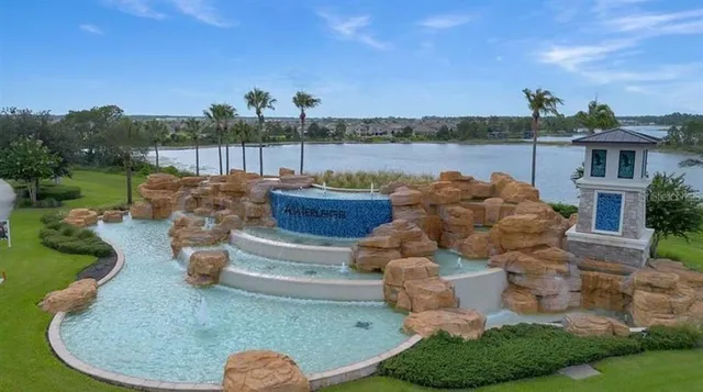 a view of a swimming pool with a patio