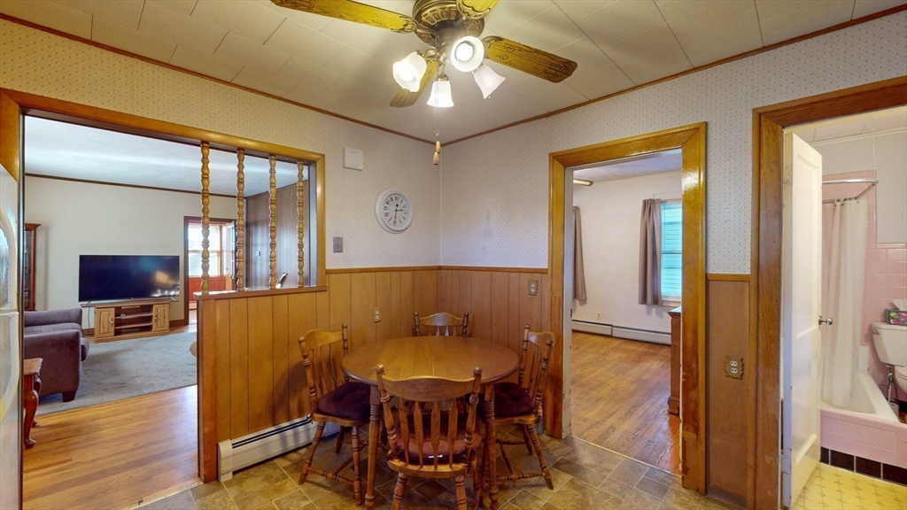 99 Lyons Street Springfield, MA 01151 - Photo 16 of 41 a view of a dining room with furniture and wooden floor