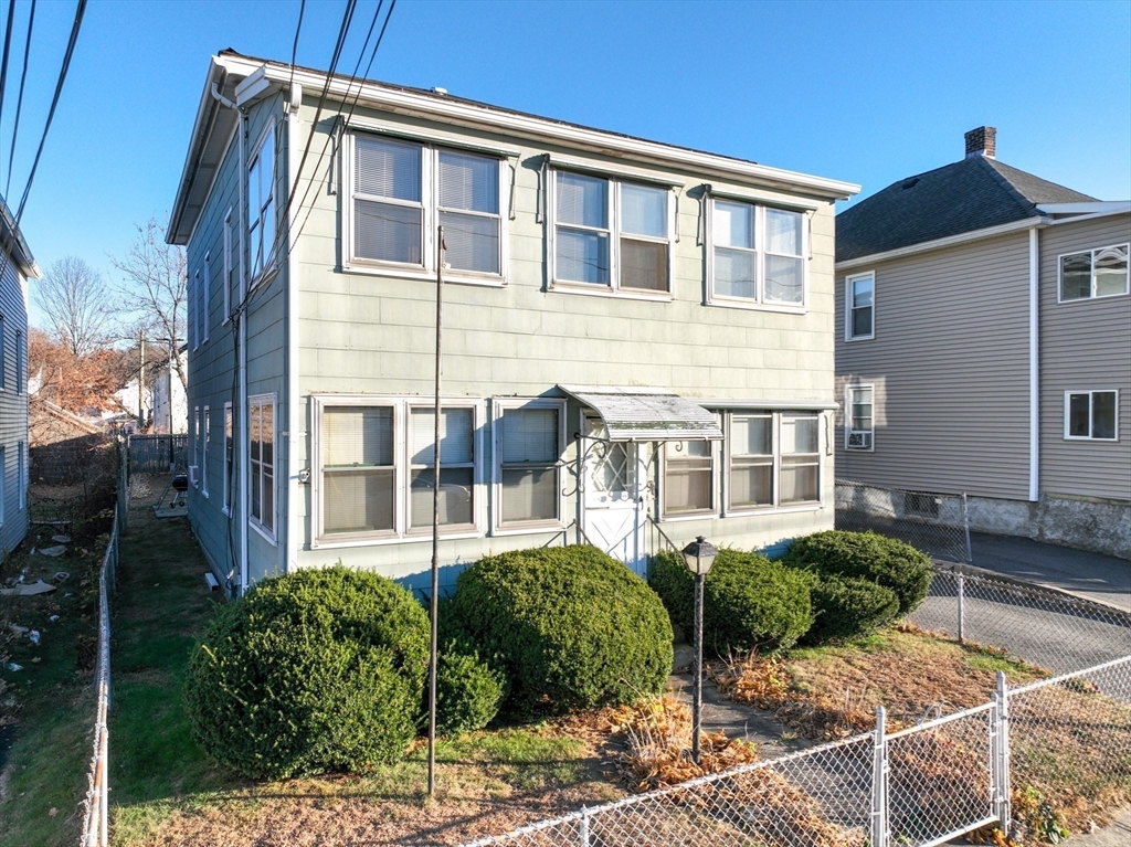99 Lyons Street Springfield, MA 01151 - Photo 33 of 41 a front view of a house with garden