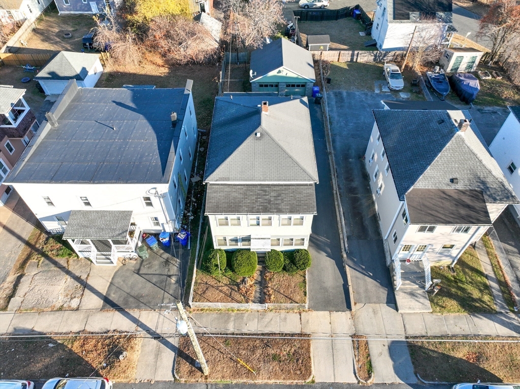 99 Lyons Street Springfield, MA 01151 - Photo 35 of 41 an aerial view of a house with a yard and potted plants