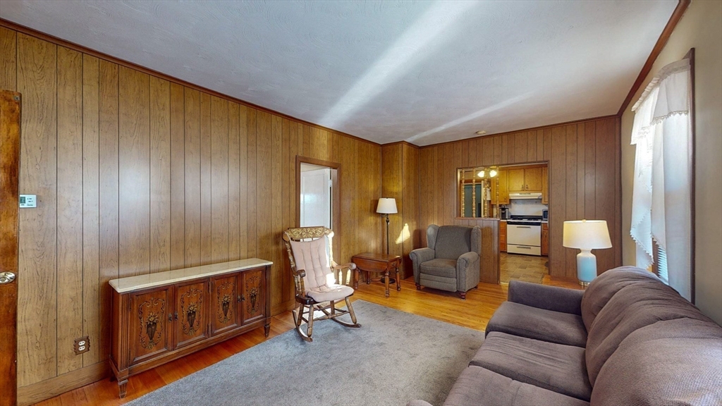 99 Lyons Street Springfield, MA 01151 - Photo 5 of 41 a living room with furniture and a window