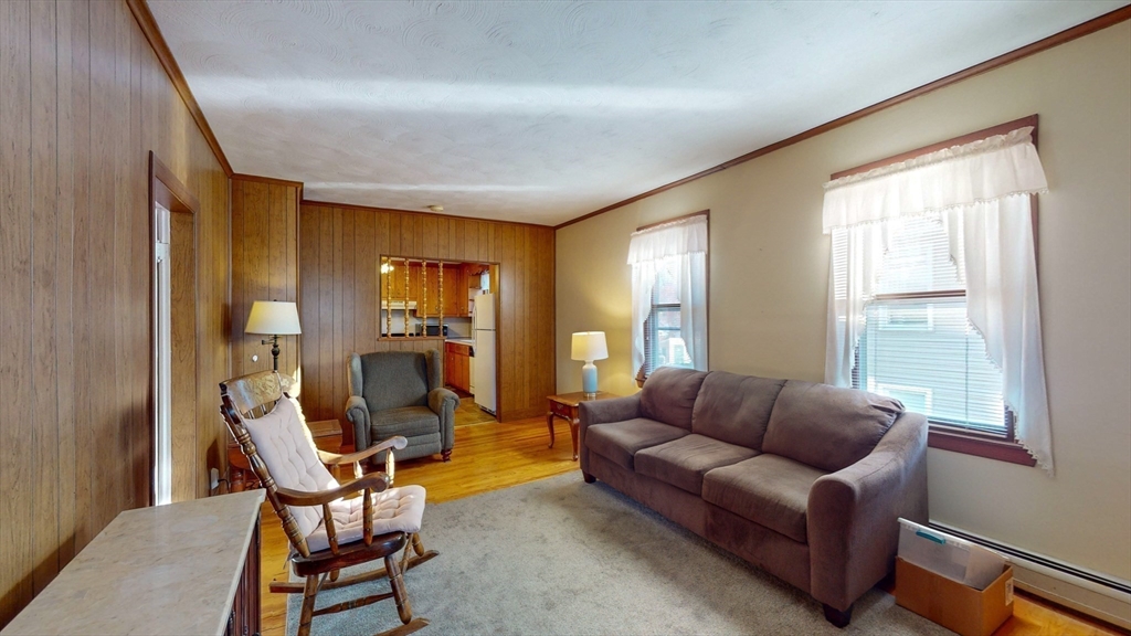 99 Lyons Street Springfield, MA 01151 - Photo 6 of 41 a living room with furniture and a large window