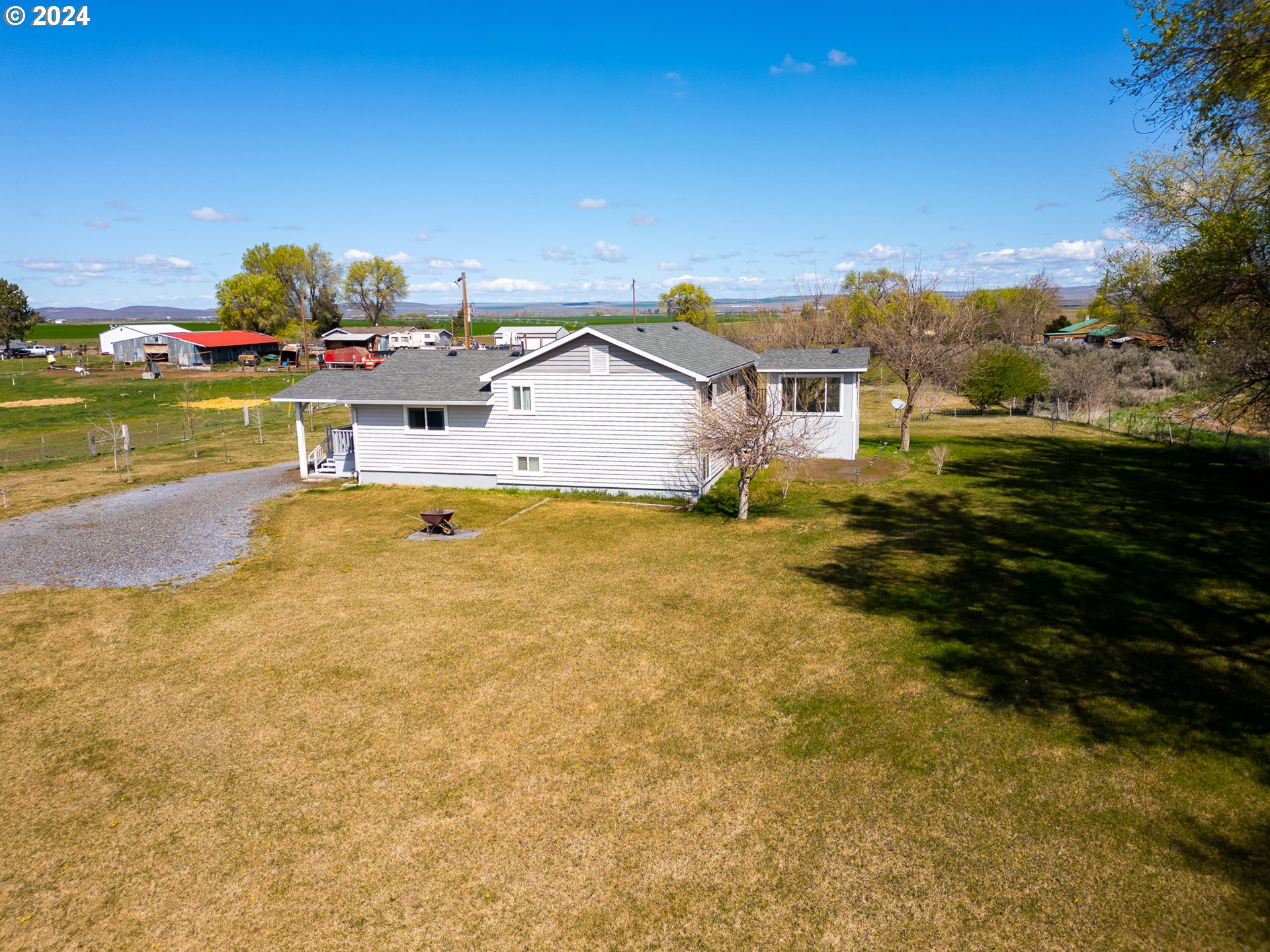 32256 West Walls Road Hermiston, OR 97838 - Photo 34 of 41 a view of a house with a yard