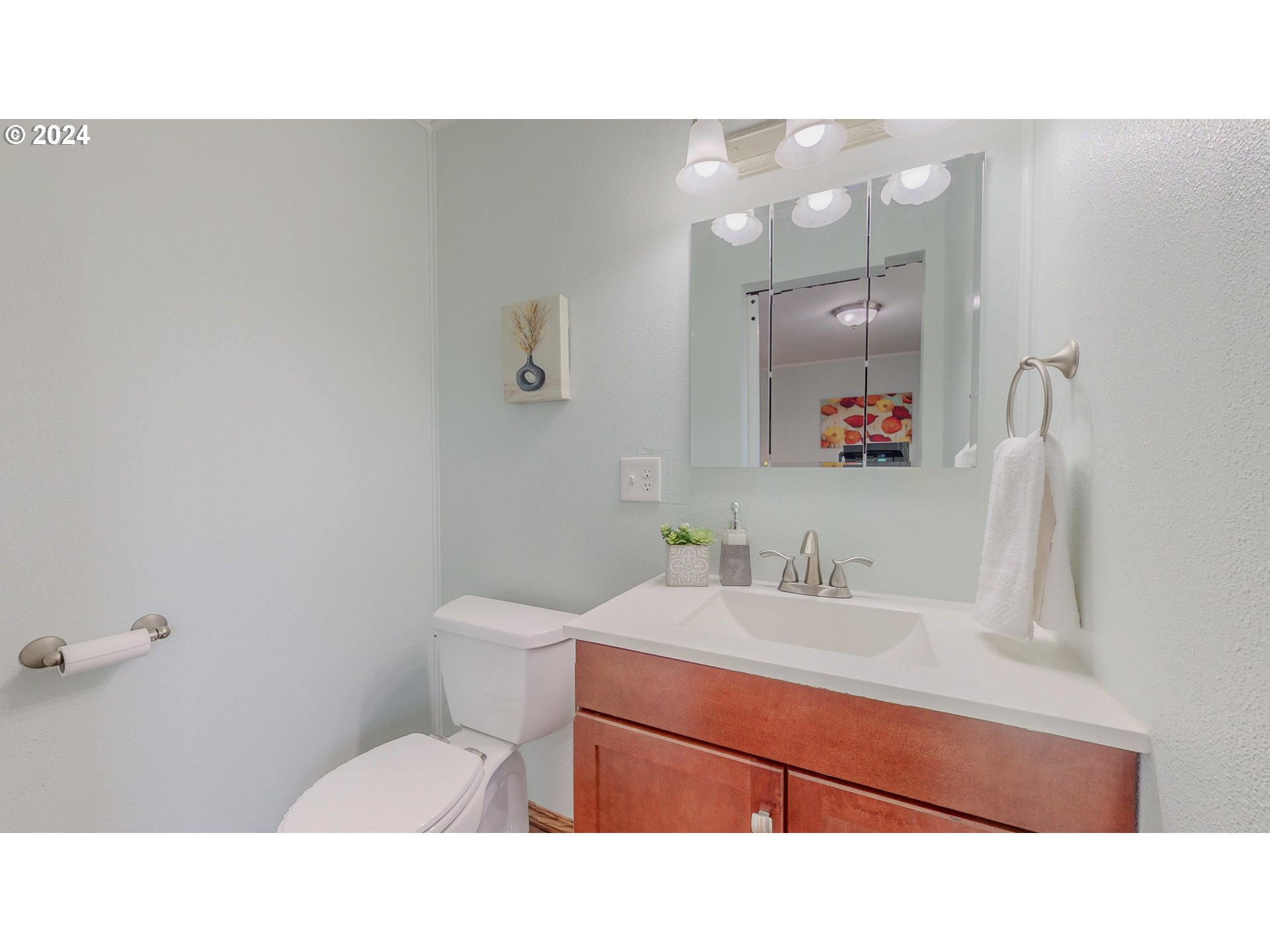 32256 West Walls Road Hermiston, OR 97838 - Photo 6 of 41 a bathroom with a sink vanity mirror and toilet