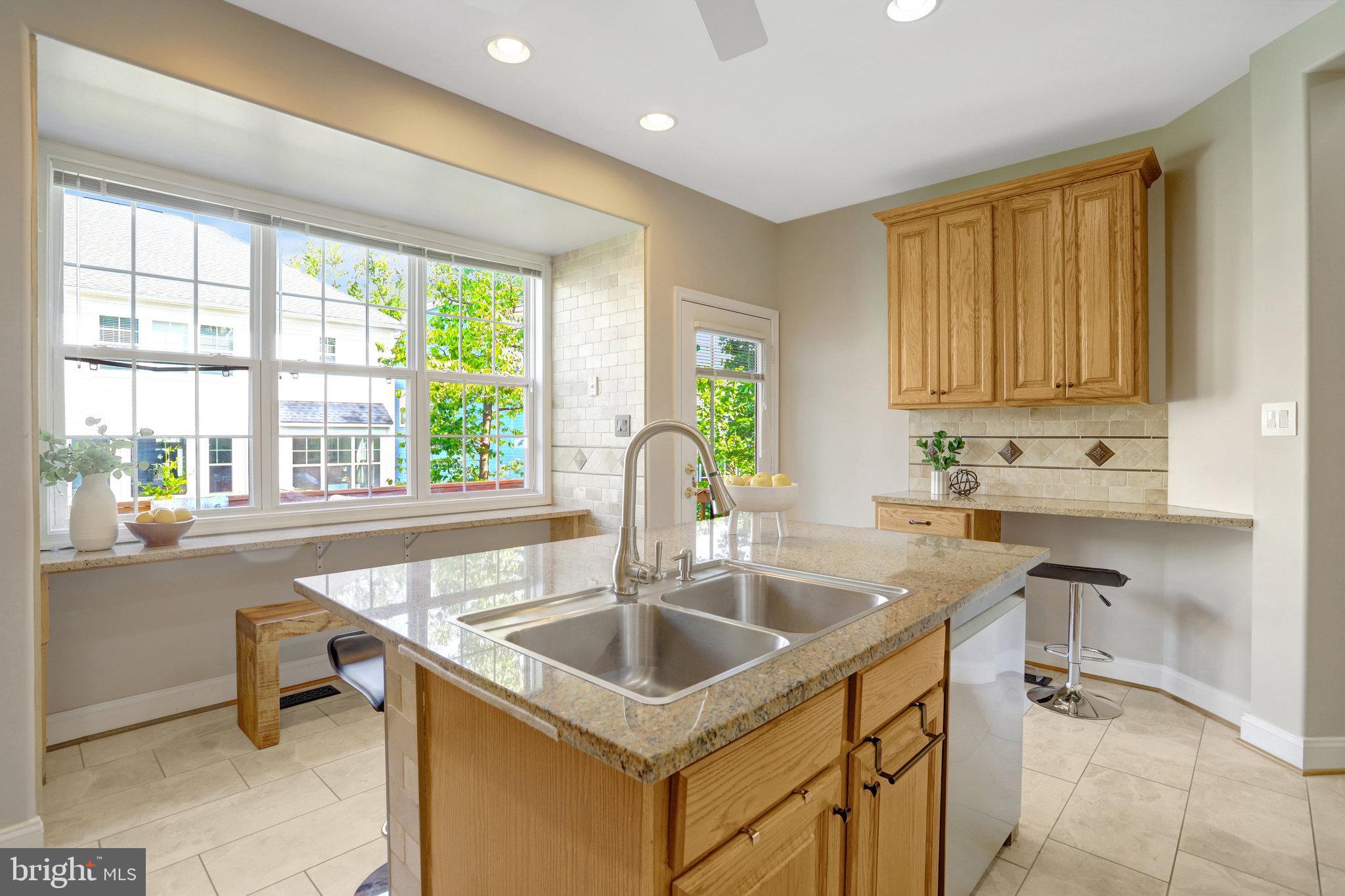 8552 Bauer Circle Springfield, VA 22152 - Photo 17 of 64 a kitchen with a sink stove and cabinets