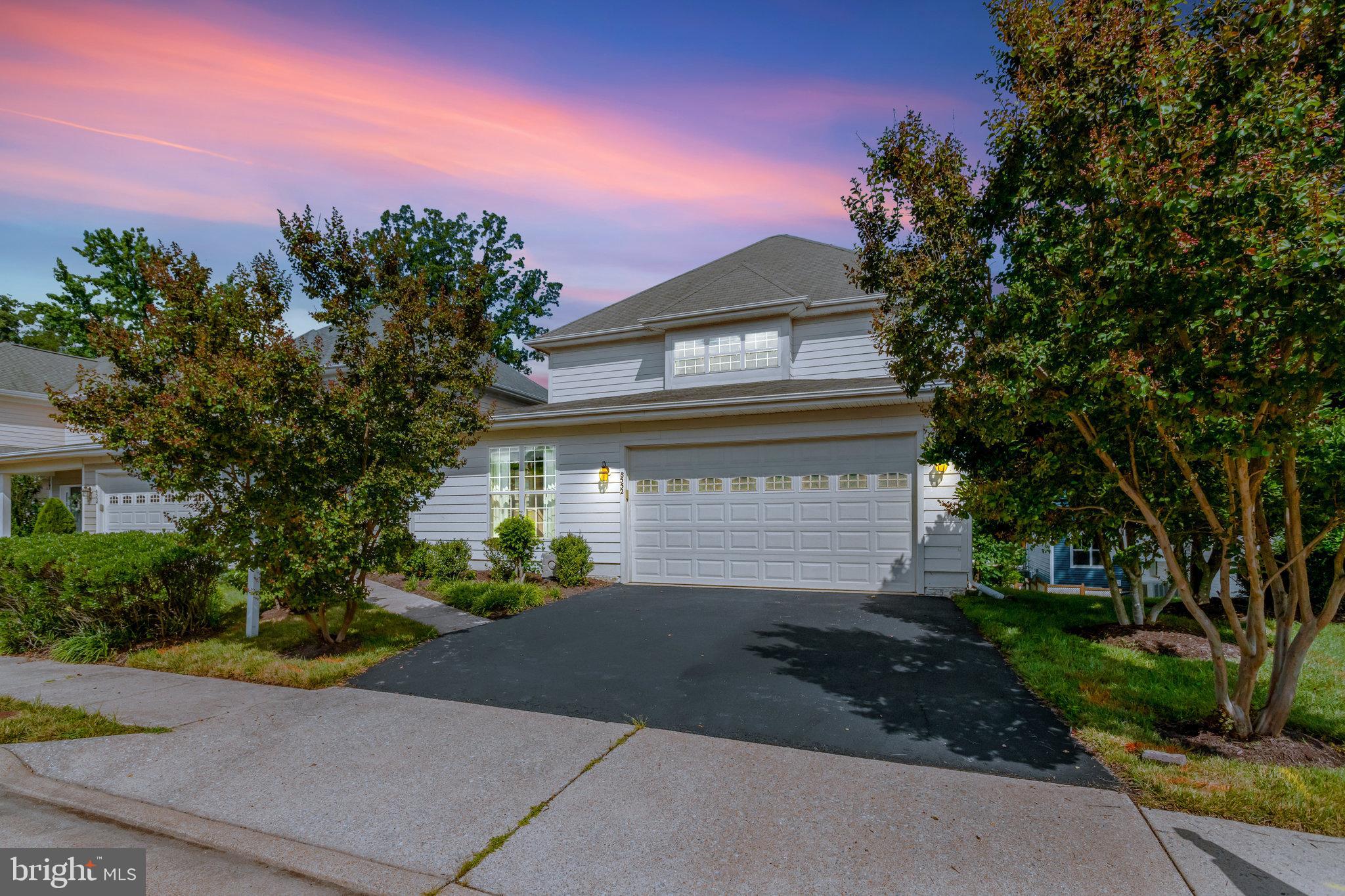 8552 Bauer Circle Springfield, VA 22152 - Photo 2 of 64 a front view of a house with a yard and a garage