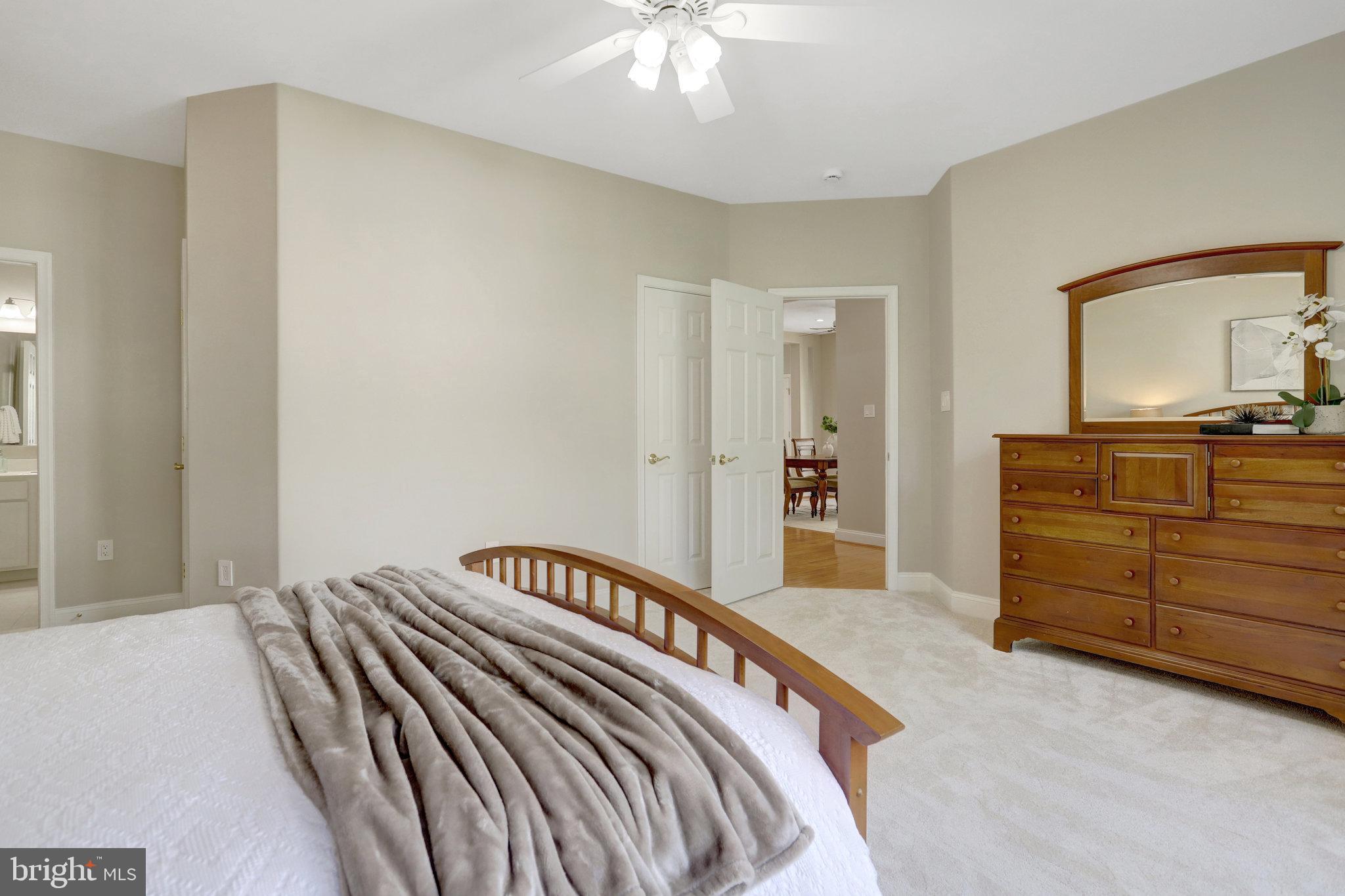 8552 Bauer Circle Springfield, VA 22152 - Photo 26 of 64 a bedroom with a bed and a dresser