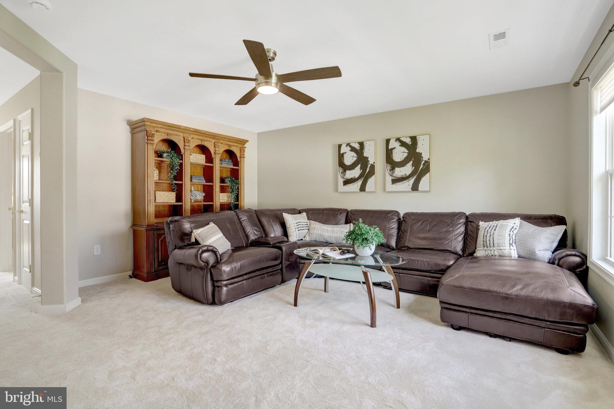 8552 Bauer Circle Springfield, VA 22152 - Photo 41 of 64 a living room with furniture and a ceiling fan
