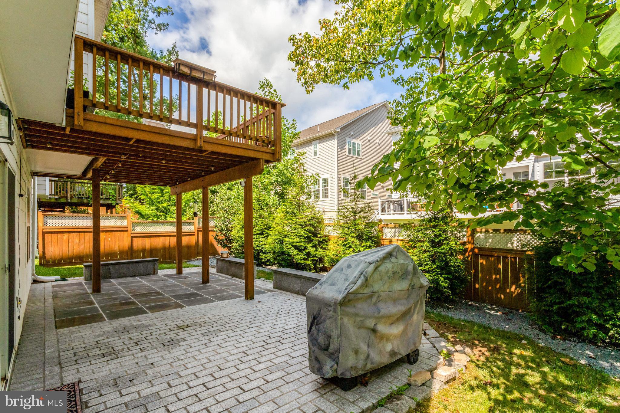 8552 Bauer Circle Springfield, VA 22152 - Photo 54 of 64 a view of a porch with a table chairs and a potted plant