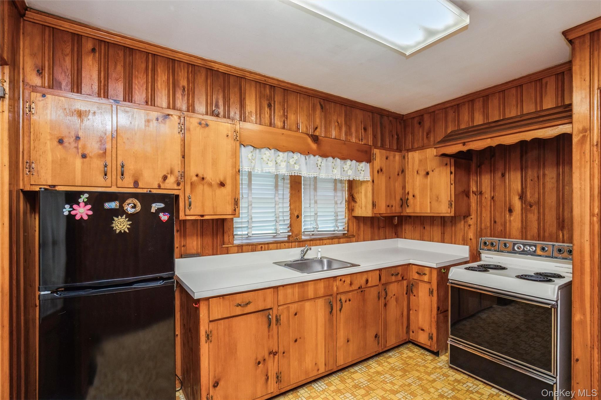 10 Laurel Road Ronkonkoma, NY 11779 - Photo 8 of 21 a kitchen with a sink stove and cabinets