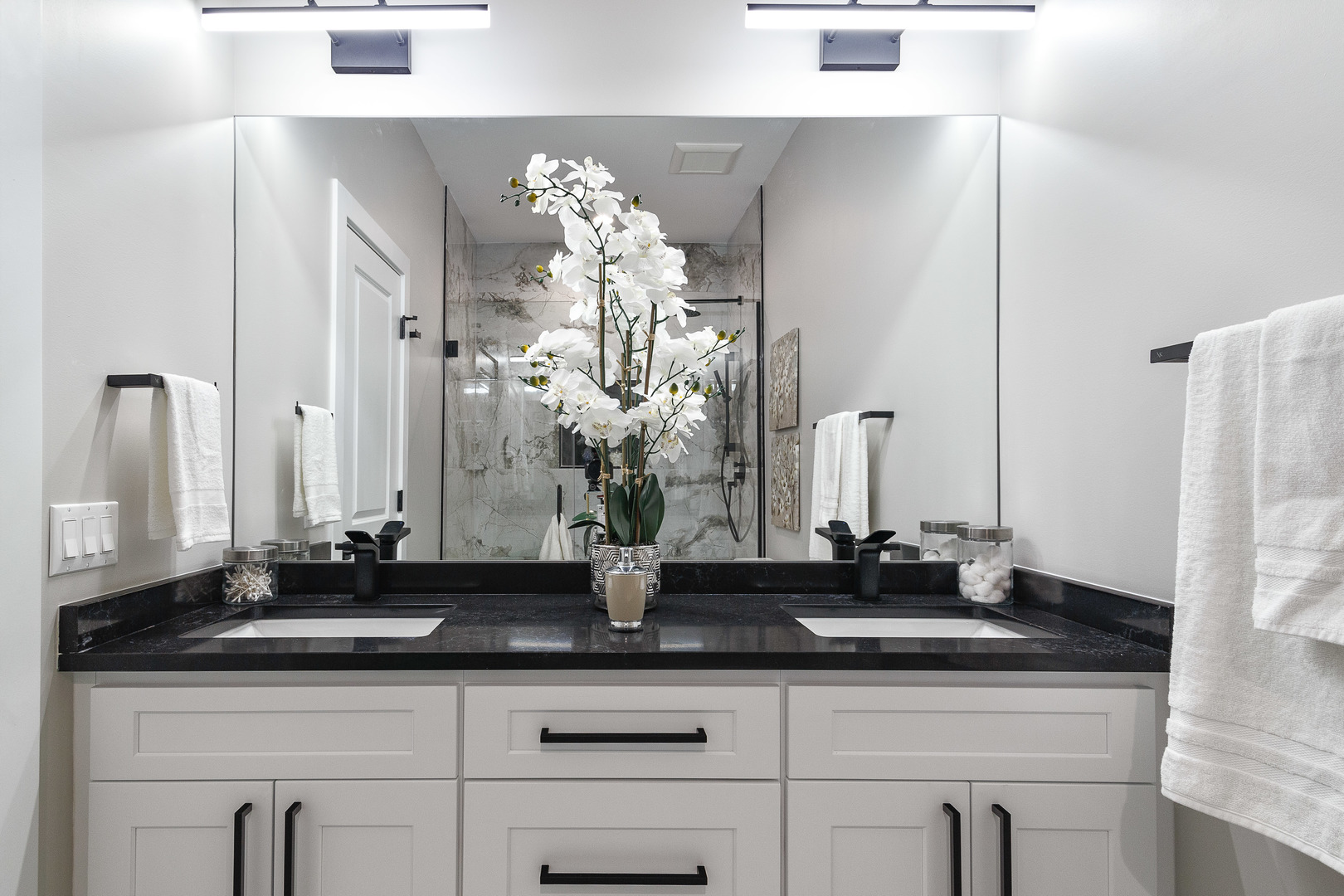 3502 North Central Avenue Chicago, IL 60634 - Photo 18 of 33 a bathroom with a sink a mirror and a shower