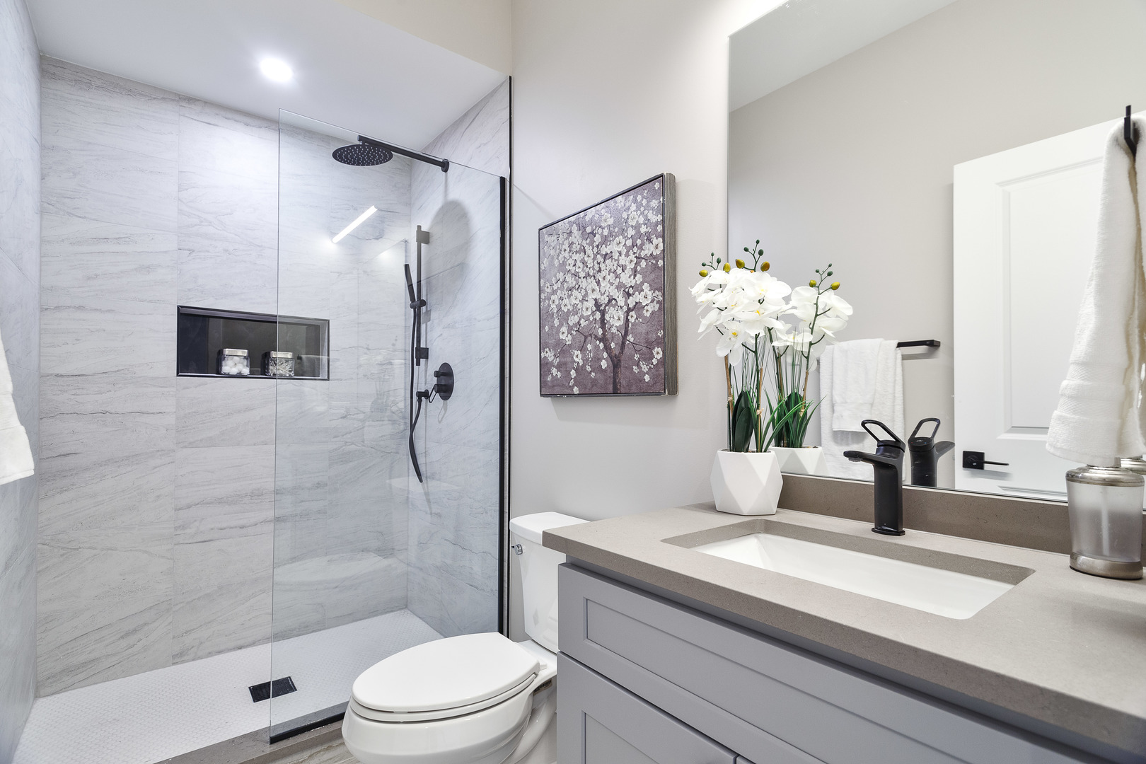 3502 North Central Avenue Chicago, IL 60634 - Photo 25 of 33 a bathroom with a sink a toilet and shower