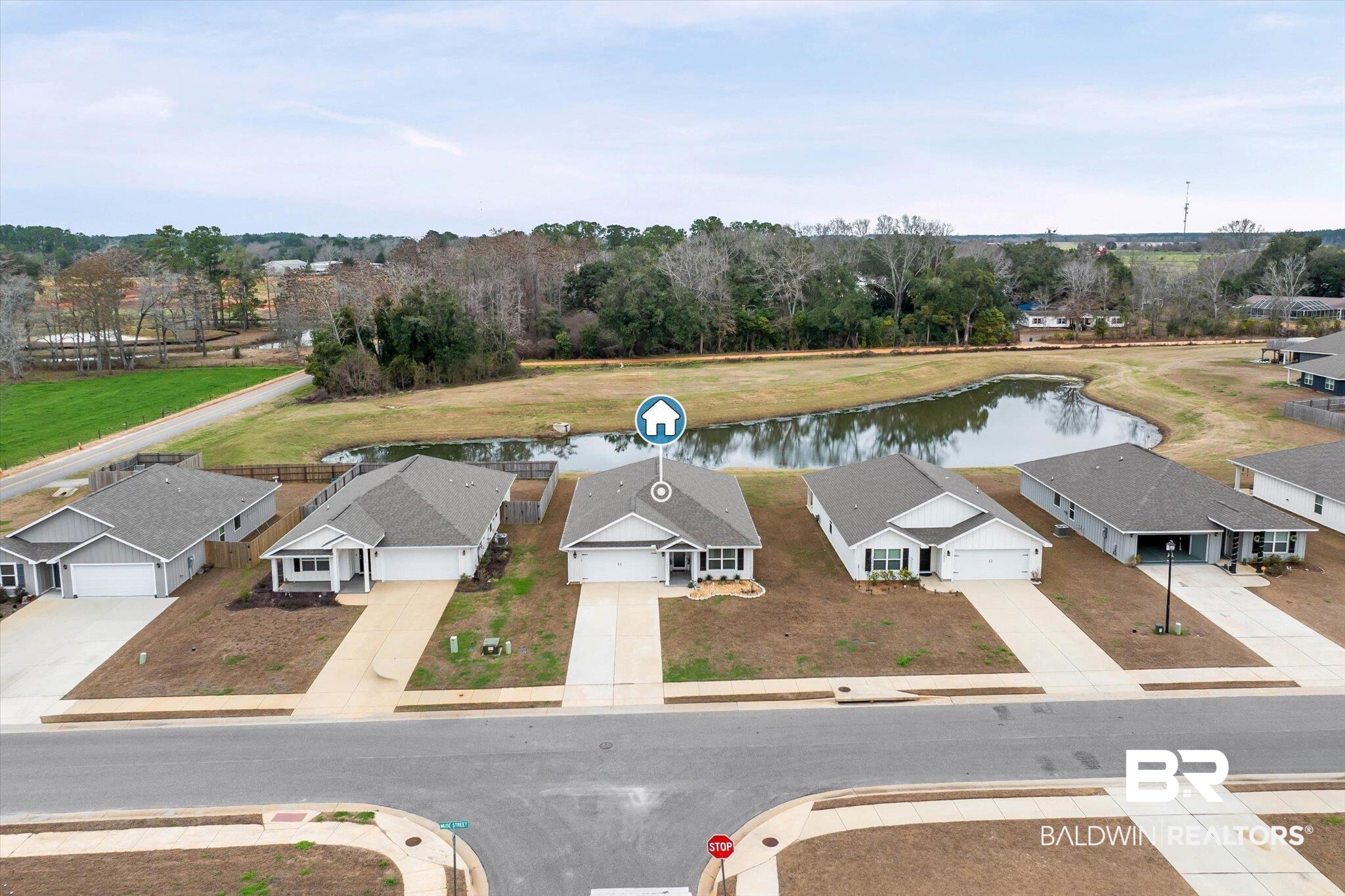 17041 Muse Street Loxley, AL 36551 - Photo 33 of 44 Aerial perspective of suburban area with a nearby body of water