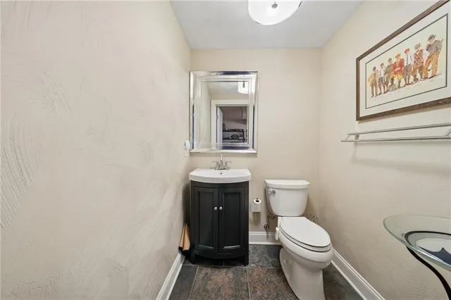 a bathroom with a toilet and a sink