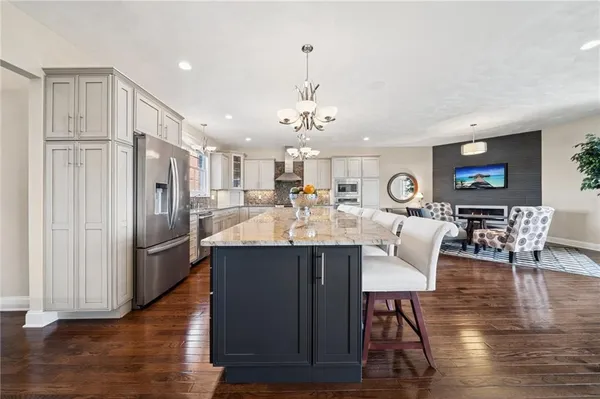 a view of kitchen and dining area with wooden floor