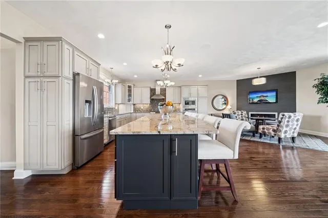 a view of kitchen and dining area with wooden floor