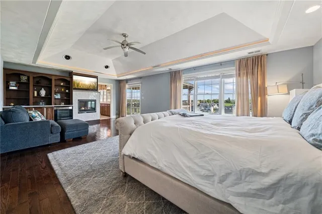 a spacious bedroom with a large bed and a couch