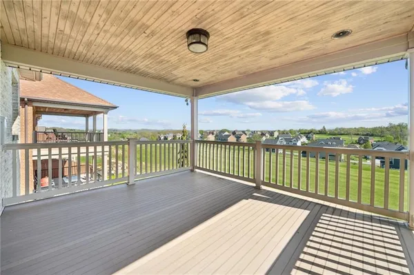 a balcony with wooden floor