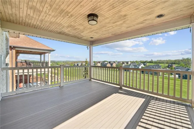 a balcony with wooden floor