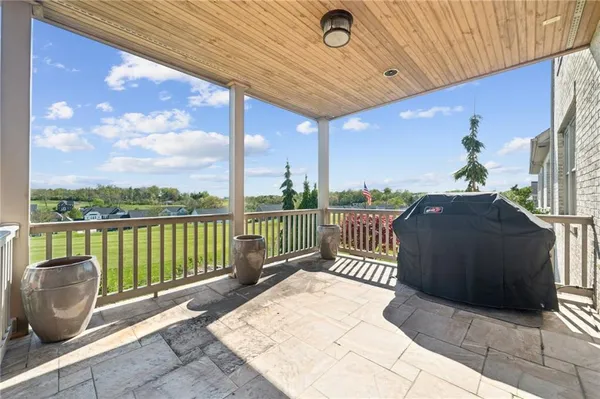 a view of a balcony with furniture