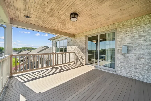 a view of a balcony with wooden floor