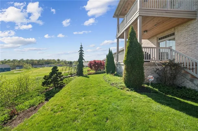 a view of a garden with a building in the background