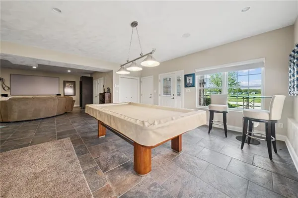 a kitchen with a table and chairs in it
