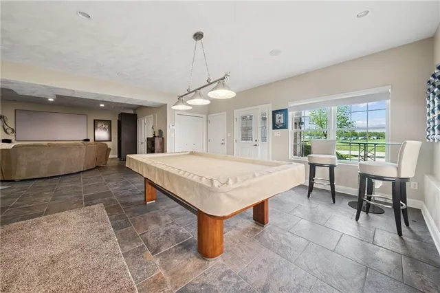 a kitchen with a table and chairs in it