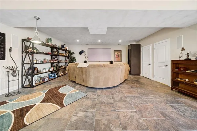 a view of a livingroom with furniture and a ceiling fan