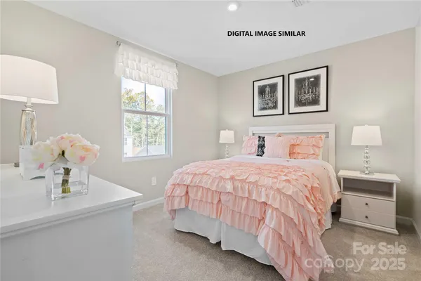 a bedroom with a bed and a table
