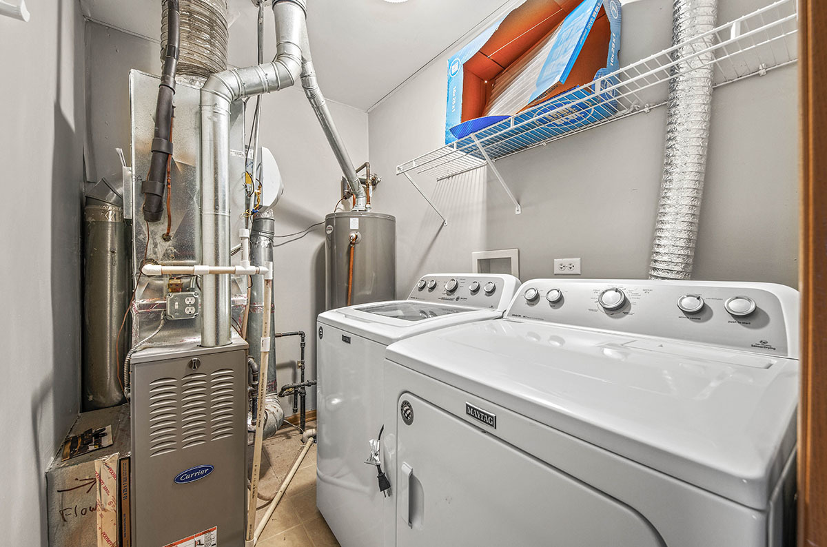 824 County Line Road Aurora, IL 60502 - Photo 17 of 18 a utility room with dryer and washer