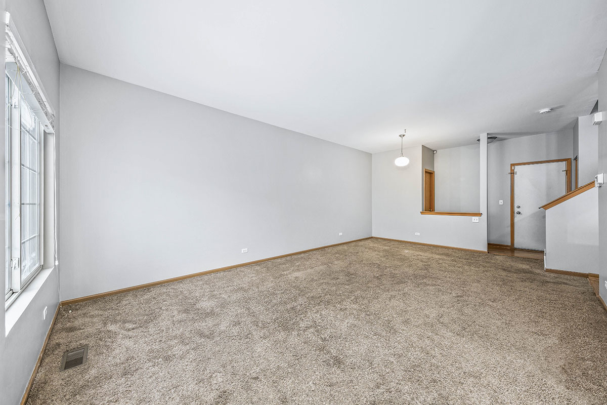 824 County Line Road Aurora, IL 60502 - Photo 5 of 18 an empty room with a natural light
