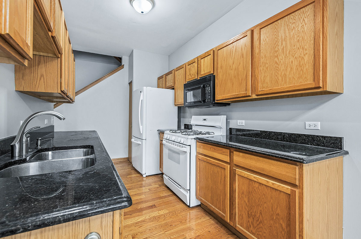 824 County Line Road Aurora, IL 60502 - Photo 7 of 18 a kitchen with stainless steel appliances granite countertop a sink stove and refrigerator