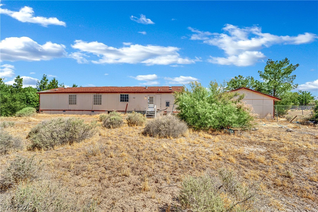 4361 Maple Road Pahrump, NV 89048 - Photo 43 of 46 A well-maintained single-story home nestled on a spacious lot, offering ample outdoor potential.