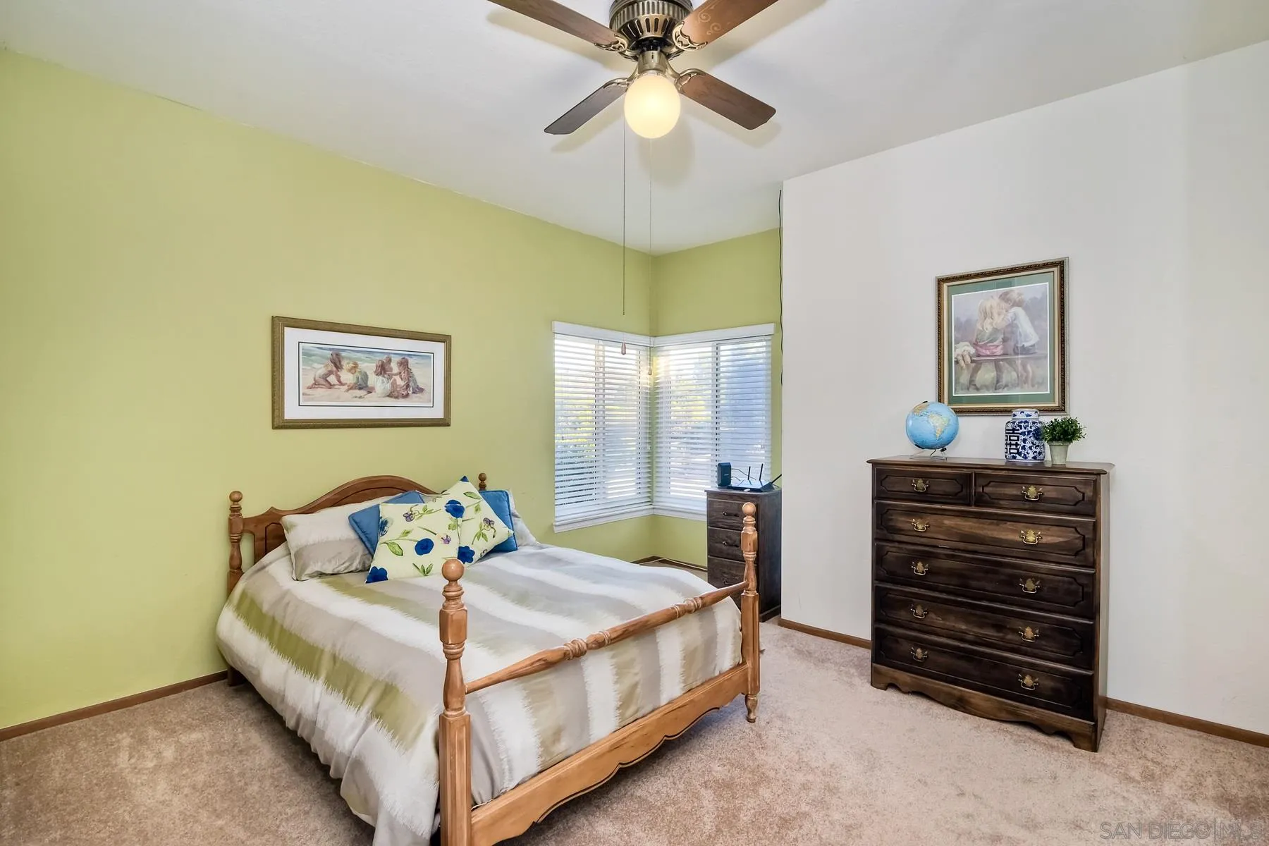13892 Oakstand Road Poway, CA 92064 - Photo 13 of 27 a bedroom with a bed and a chandelier