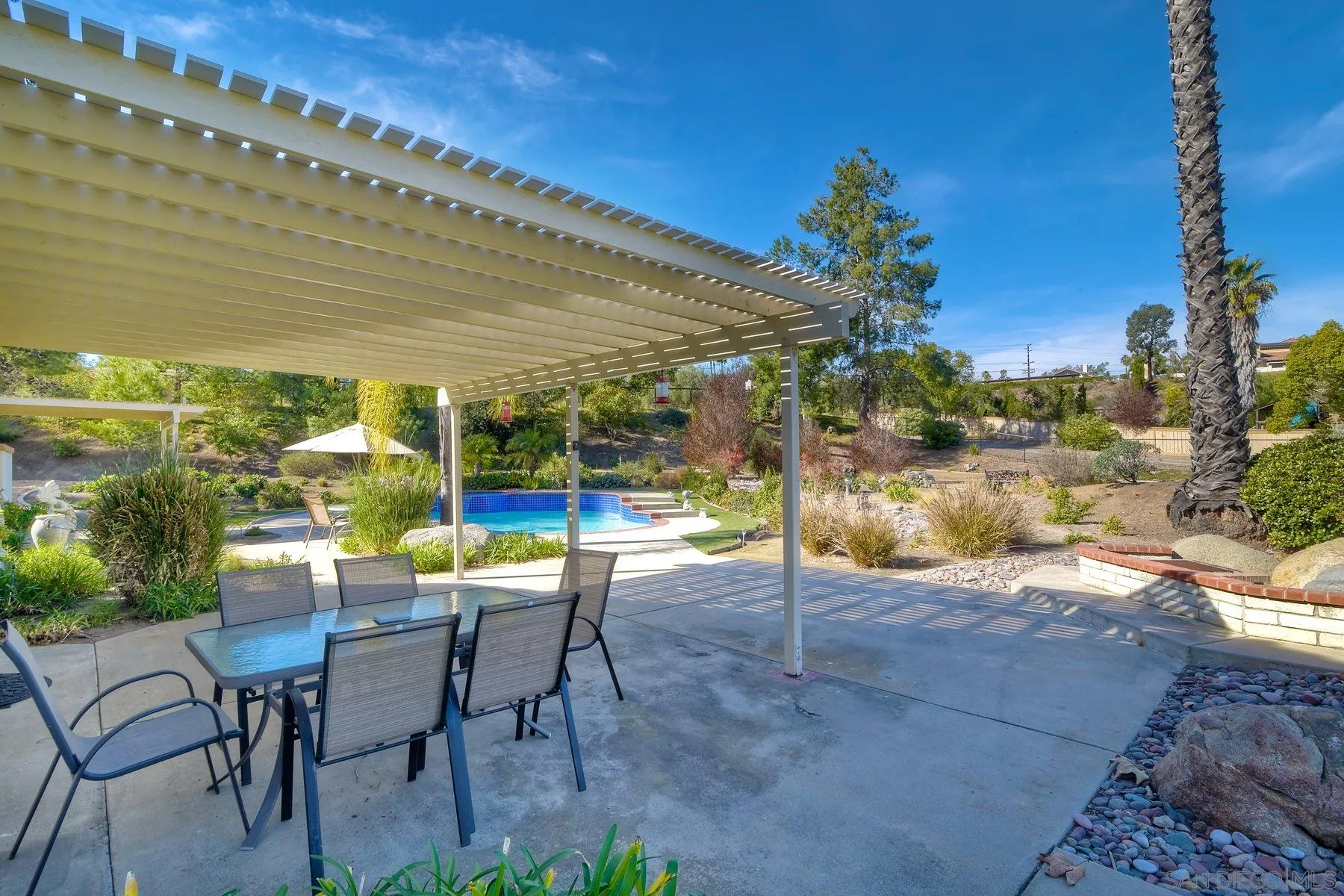 13892 Oakstand Road Poway, CA 92064 - Photo 19 of 27 a view of an chairs and tables in the patio