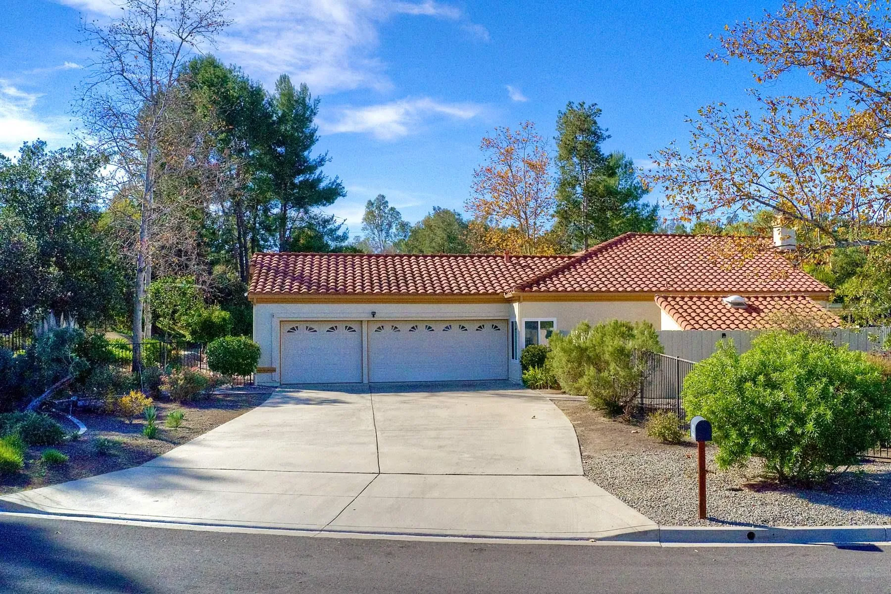 13892 Oakstand Road Poway, CA 92064 - Photo 2 of 27 a front view of a house with a garden