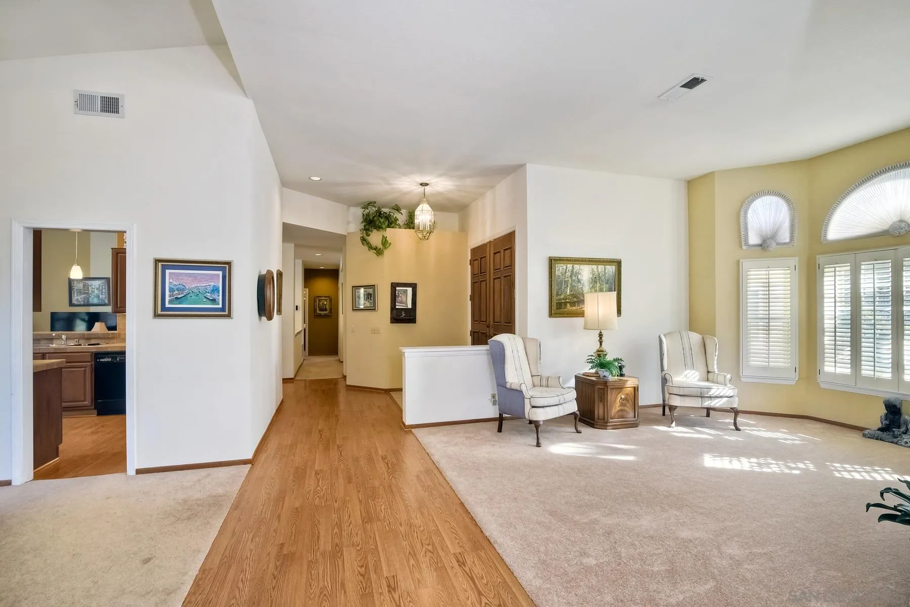 13892 Oakstand Road Poway, CA 92064 - Photo 3 of 27 a living room with furniture and large windows