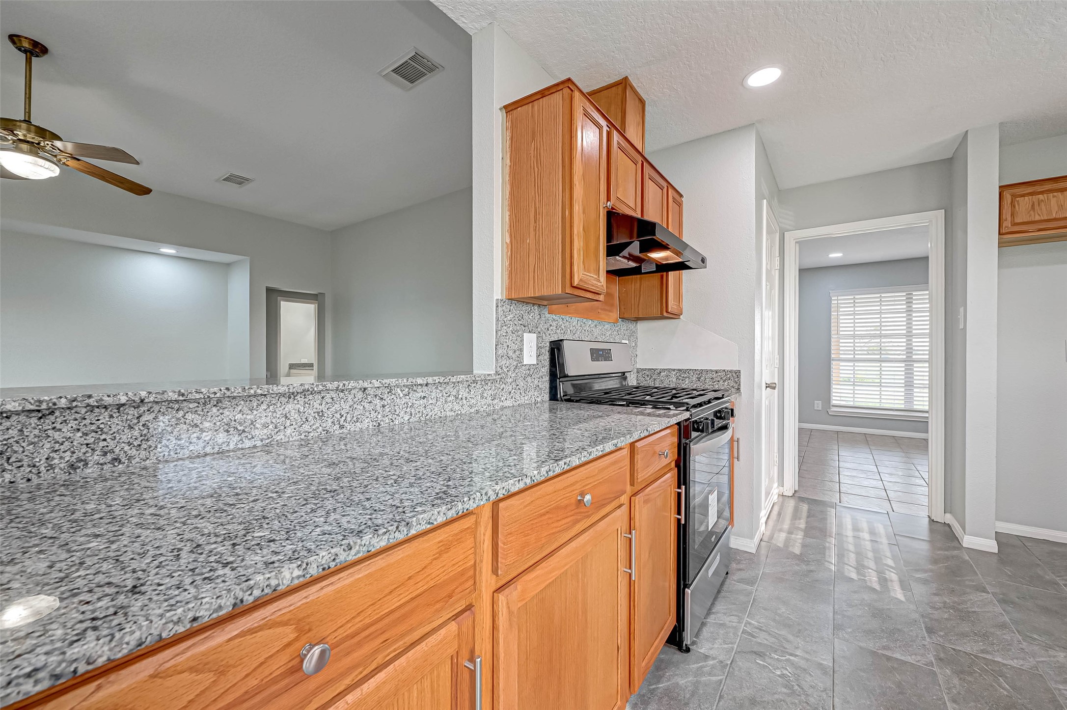 7520 Vincik Ehlert Road Rosenberg, TX 77471 - Photo 20 of 46 a kitchen with stainless steel appliances granite countertop a sink and a stove