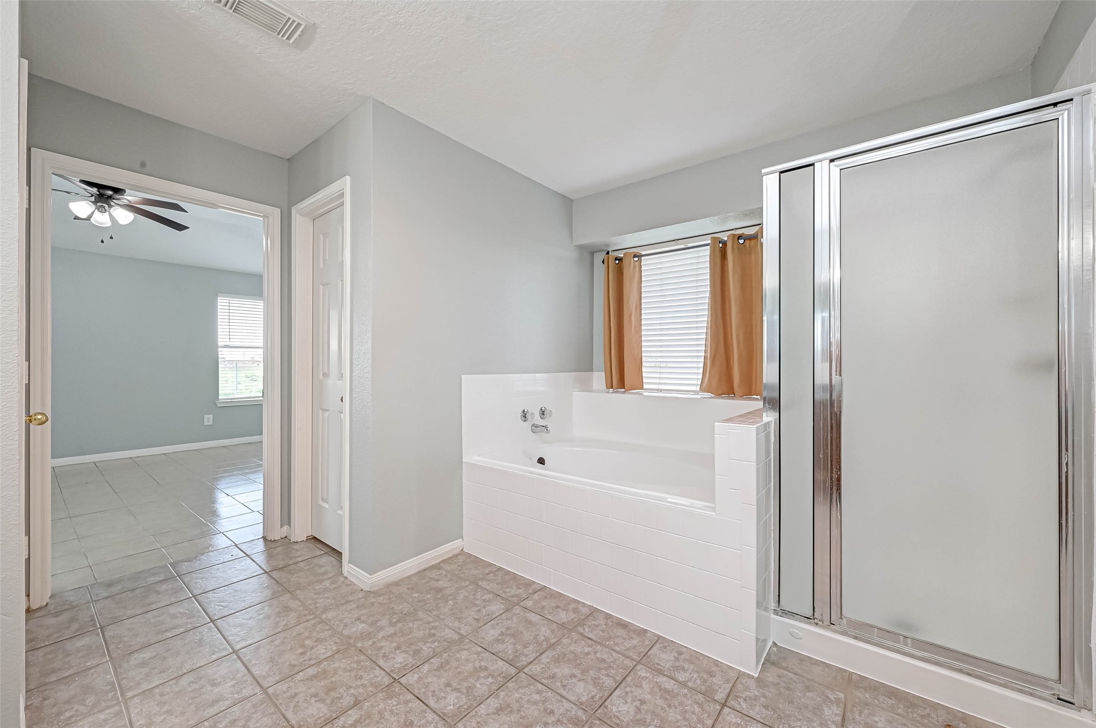 7520 Vincik Ehlert Road Rosenberg, TX 77471 - Photo 39 of 46 a bathroom with a bathtub and a shower