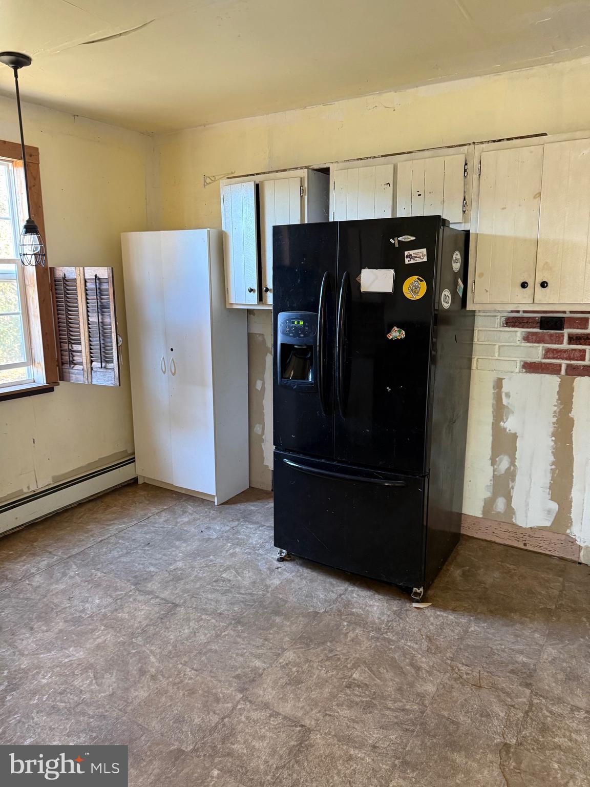 564 Front Street Houston, DE 19954 - Photo 25 of 34 a view of a refrigerator and an empty room