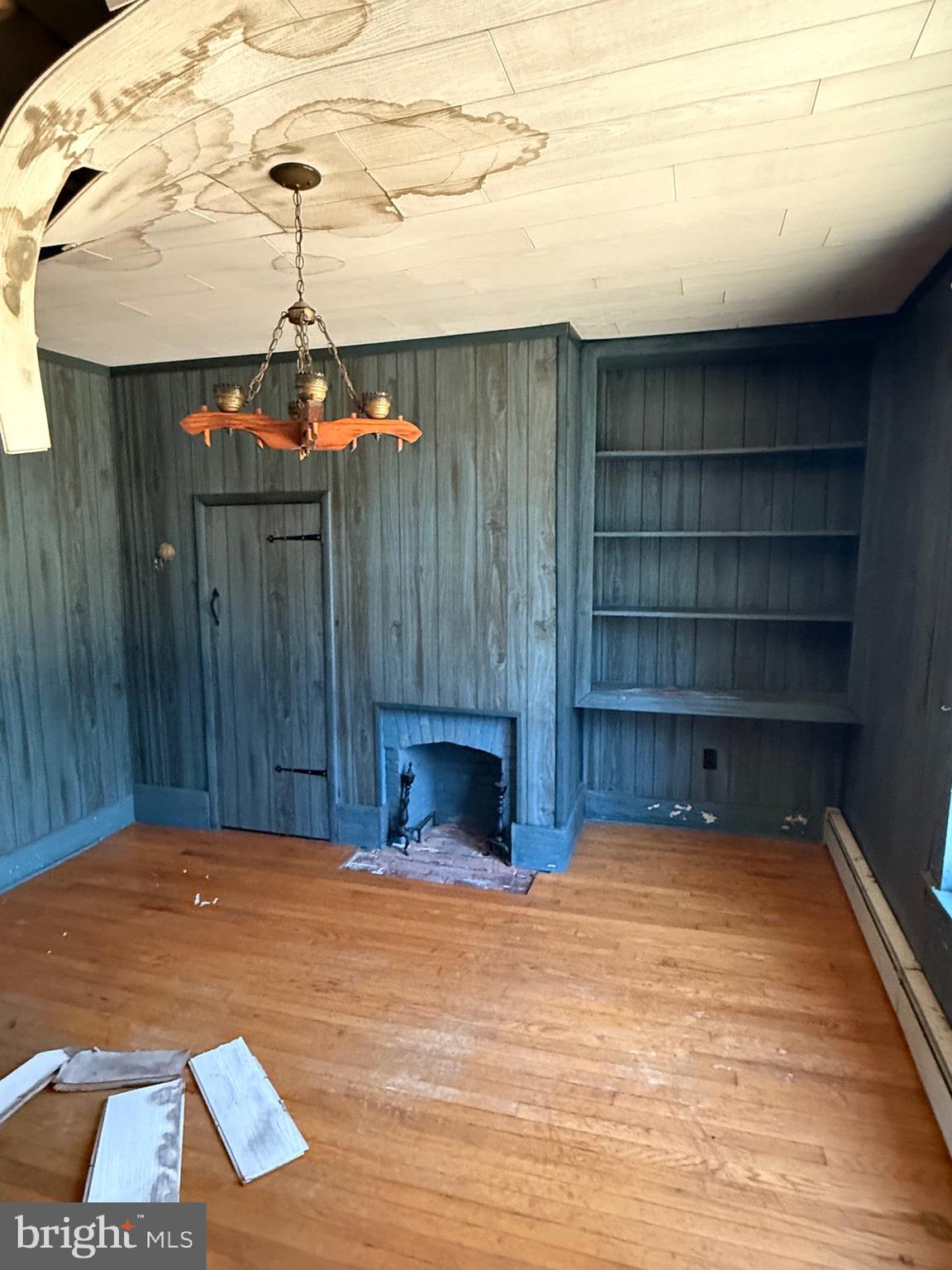 564 Front Street Houston, DE 19954 - Photo 33 of 34 a bedroom with a bed and a chandelier