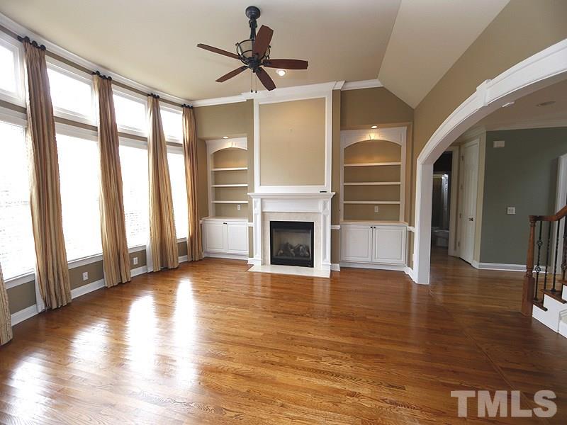 2001 Falls Farm Crossing Raleigh, NC 27614 - Photo 6 of 14 Start your morning with this sun-drenched kitchen that steps out onto the deck. Open to the Family Room which makes this home great for entertaining. Check out that curved archway with molding---it's all in the details!