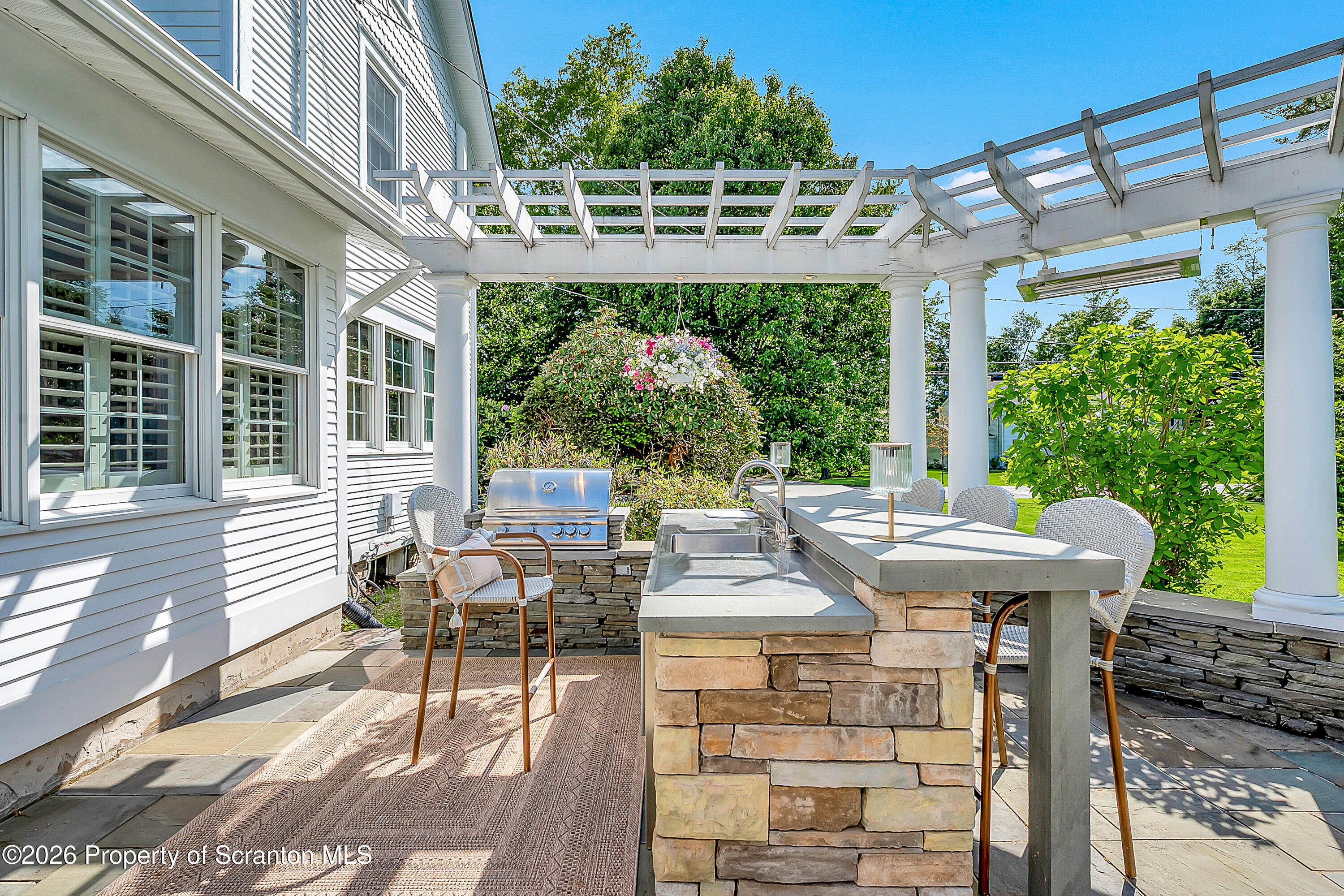 330 Glenburn Road Clarks Green, PA 18411 - Photo 8 of 69 a view of a patio with table and chairs and potted plants