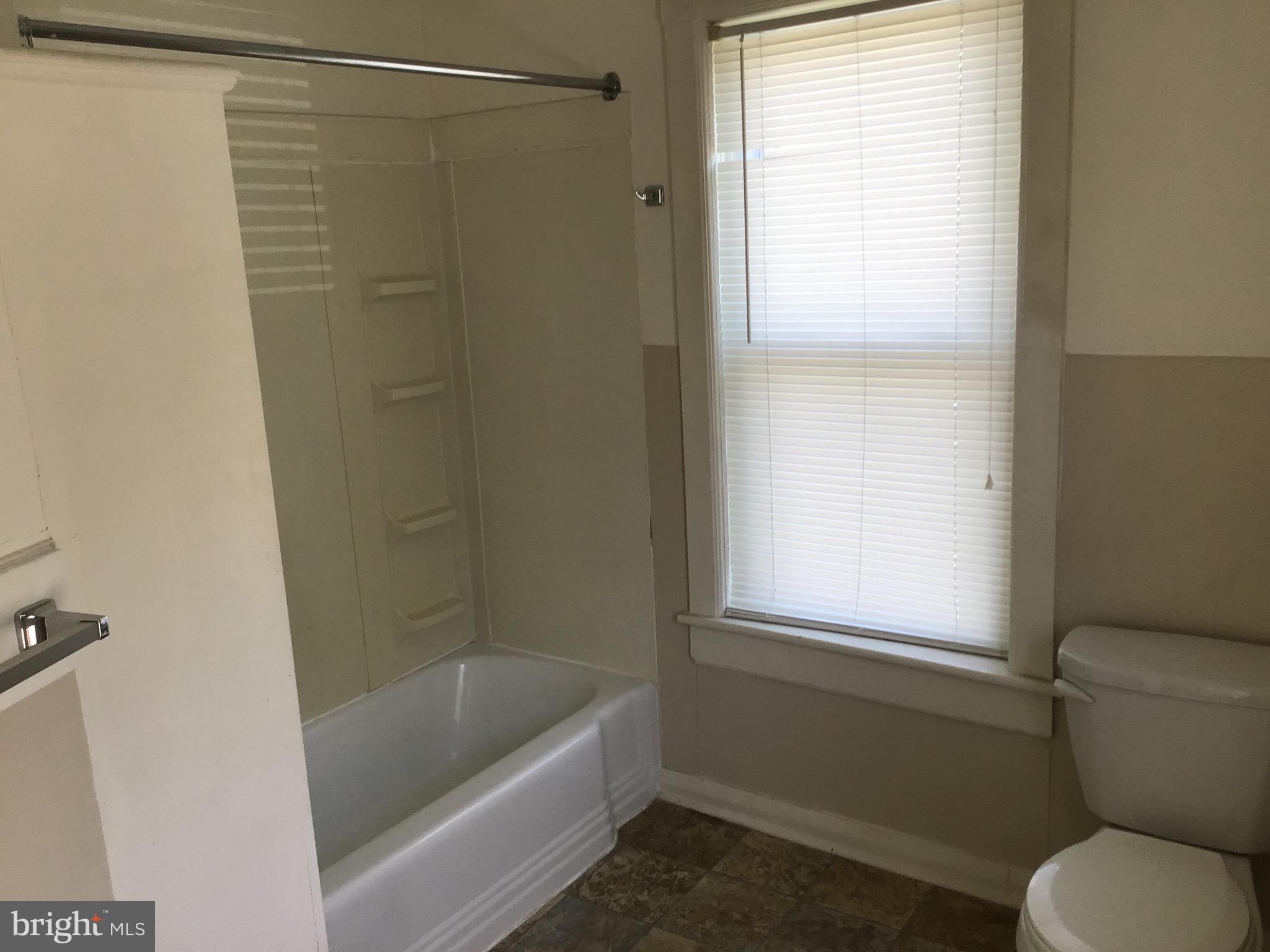 1822 East Main Street Waynesboro, PA 17268 - Photo 14 of 21 a bathroom with a toilet and a bath tub